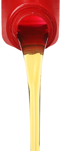 Lubricating oil being poured during equipment servicing